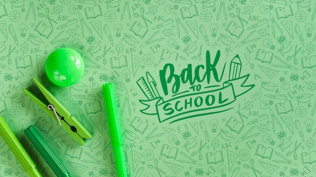 Arrangement with green supplies for back to school event Free Psd