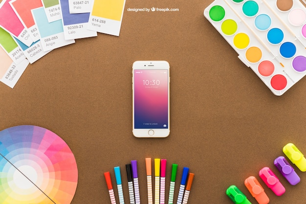 Free PSD art concept with smartphone and pencils