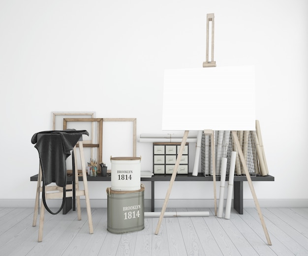 art studio with canvas, apron and paint bottles