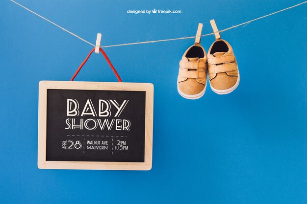 Baby mockup with shoes and slate on clothes line