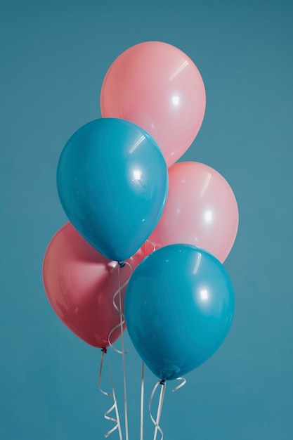 Baby pink and blue balloons