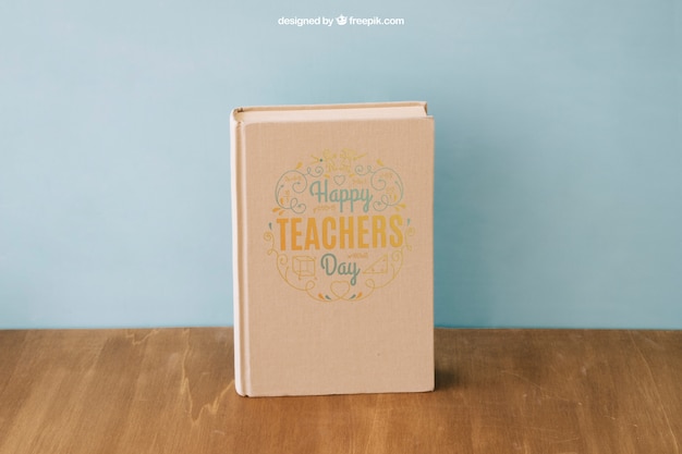 Free PSD back to school composition with book on wooden surface