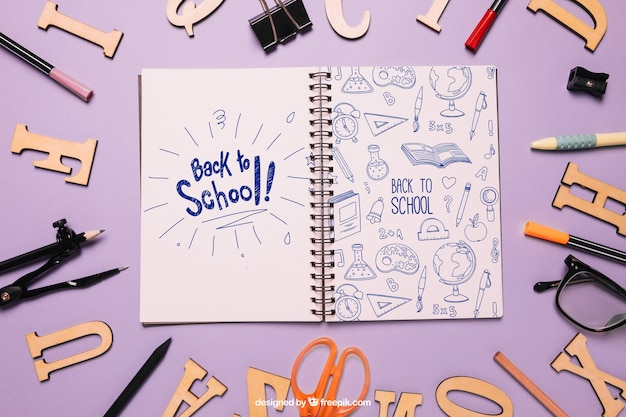 Back to school mockup with notebook and letters