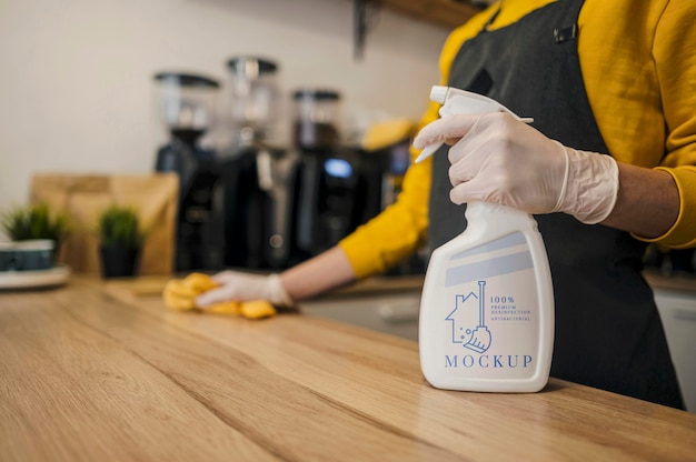 Barista cleaning counter with cleaning solution mock-up