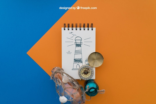 Free PSD beach items with notepad on orange and blue background