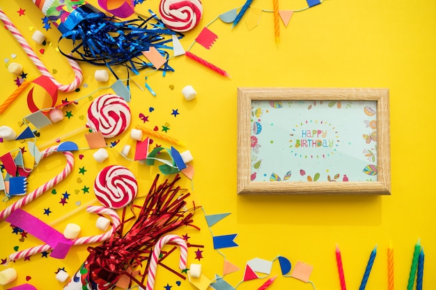 Birthday concept with frame and candy