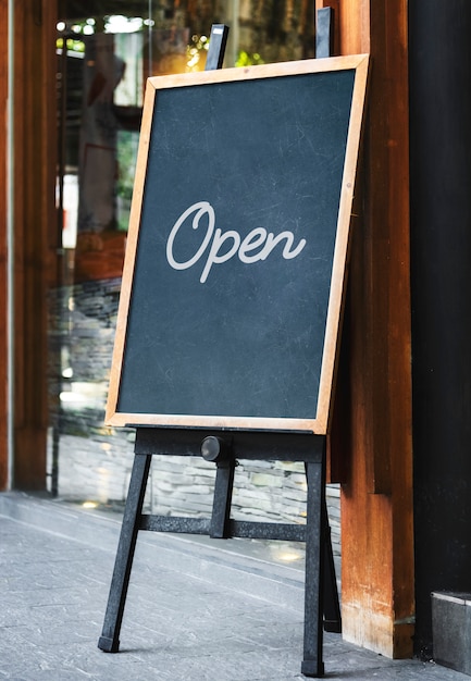 Blackboard sign mockup in front of a restaurant