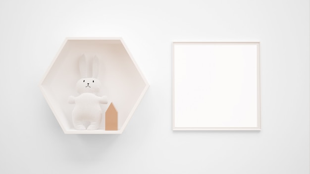 Free PSD blank photo frame mockup hanging on the wall next to a bunny toy