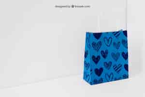 Free PSD blue paper bag in corner