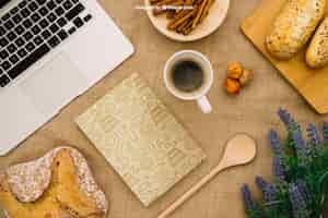 Free PSD book cover composition with breakfast and laptop