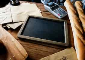 Free PSD bread next to slate in shop