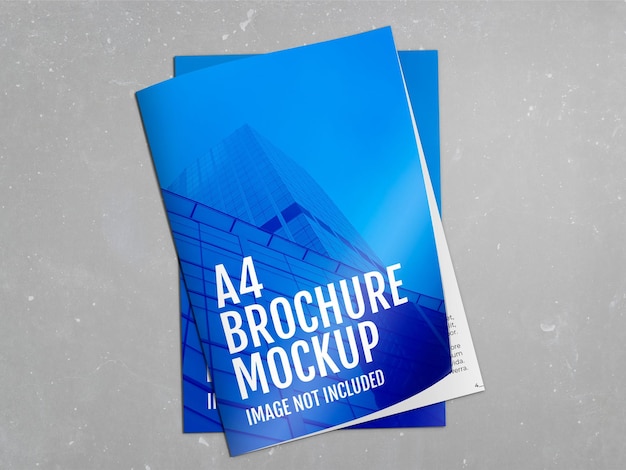 Free PSD brochures over concrete surface mockup