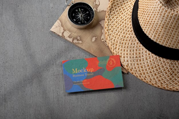 Free PSD business card mock-up with travel items