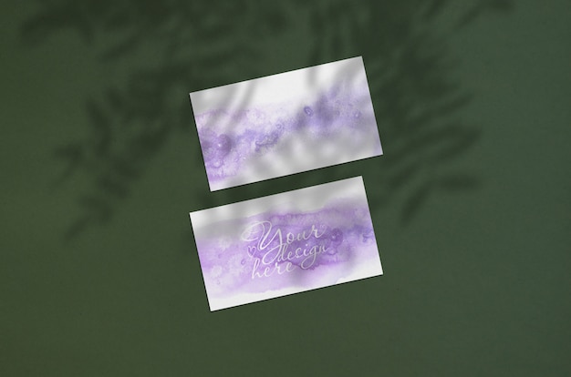 Business card mockup. natural overlay lighting shadows the leaves