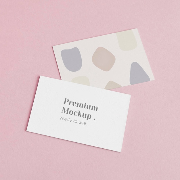 Business cards on pink background