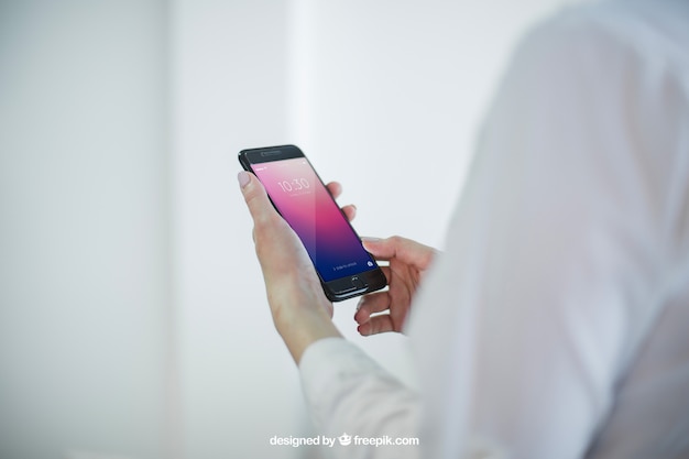 Business mock up with hands holding smartphone