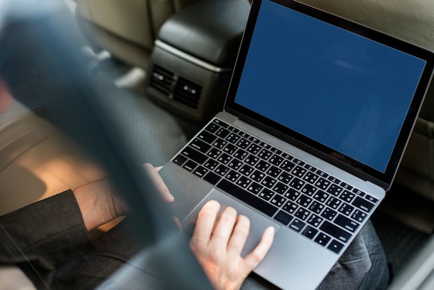 Free PSD business people using laptop in car