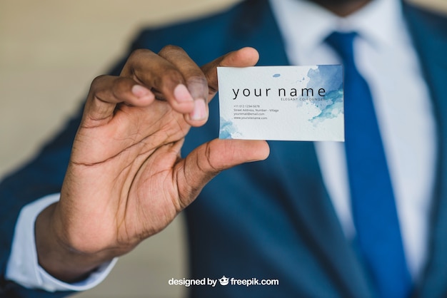 Businessman showing business card close up