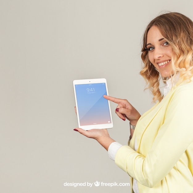 Businesswoman showing tablat