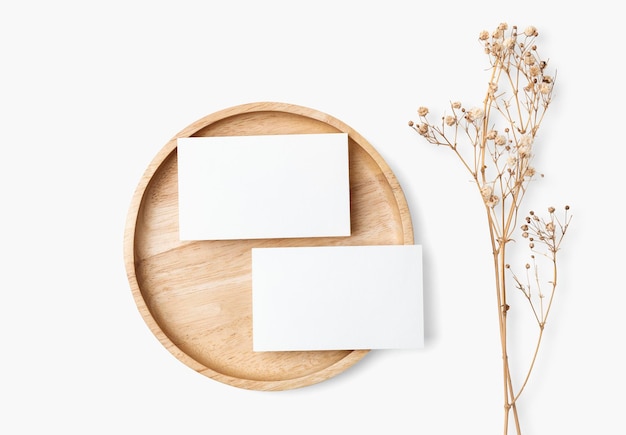 Card psd mockup on wooden plate in flat lay style