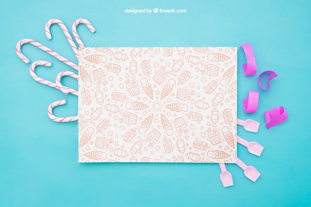 Free PSD celebration composition with paper and candy canes