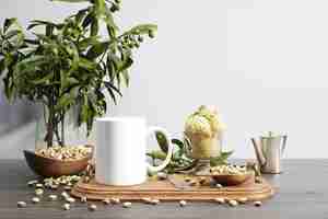 Free PSD ceramic bug and nuts bowl on wooden tray and plant