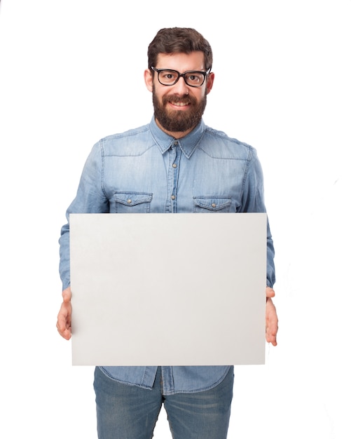 Cheerful guy showing a blank placard