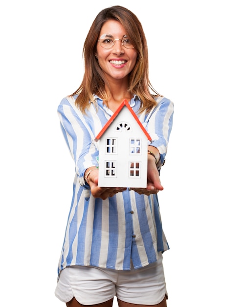 Cheerful woman with her dream house