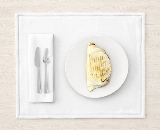 Free PSD chicken on white plate with cutlery