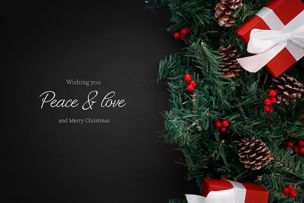 Free PSD christmas ornaments on the edge on a black background with copyspace