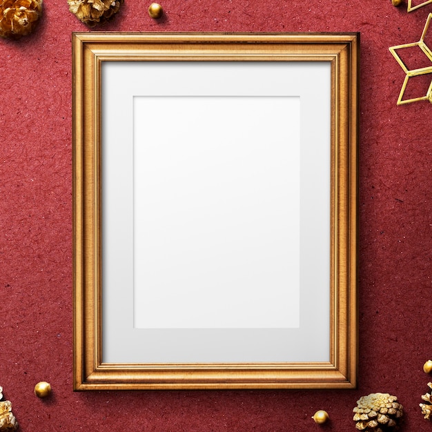 Classic gold frame mockup with christmas decorations