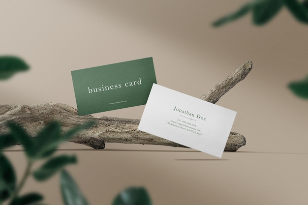 Clean minimal business card mockup on branches with leaves