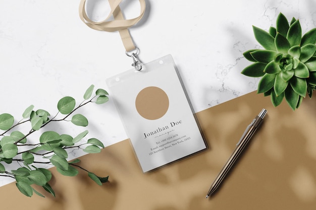 Clean minimal label mockup on marble background with leaves and pen. psd file.