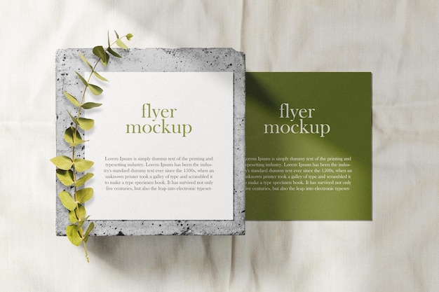 Clean minimal square flyer mockup on top brick with dry flower.