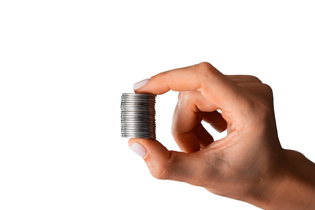 Close up on coin in hand isolated