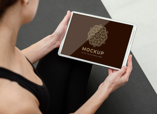 Close up woman holding tablet mockup