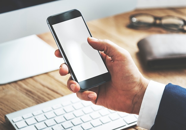 Closeup of a businessman with smartphone