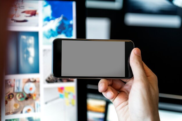 Closeup of an empty screened smartphone turned sideways