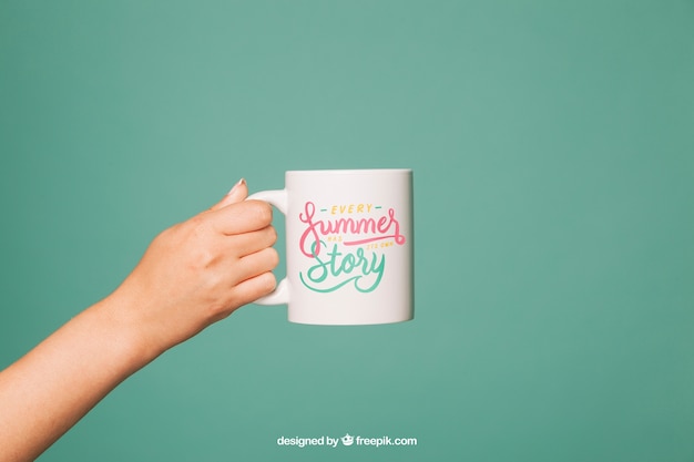 Free PSD coffee mug mockup with arm