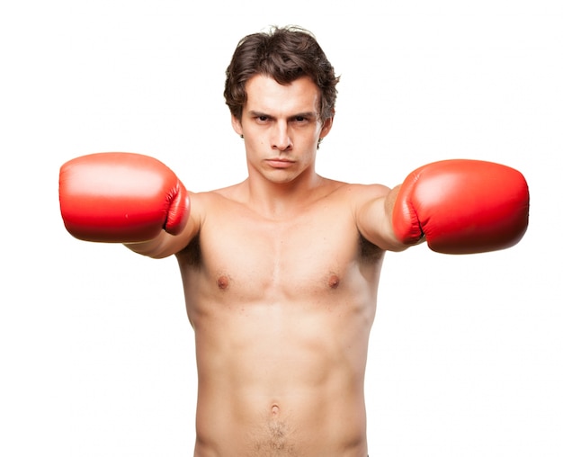 Concentrated guy with boxing gloves