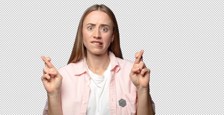 Free PSD crossing fingers anxiously and hoping for good luck with a worried look