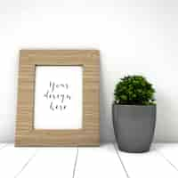 Free PSD cute frame mockup with plant