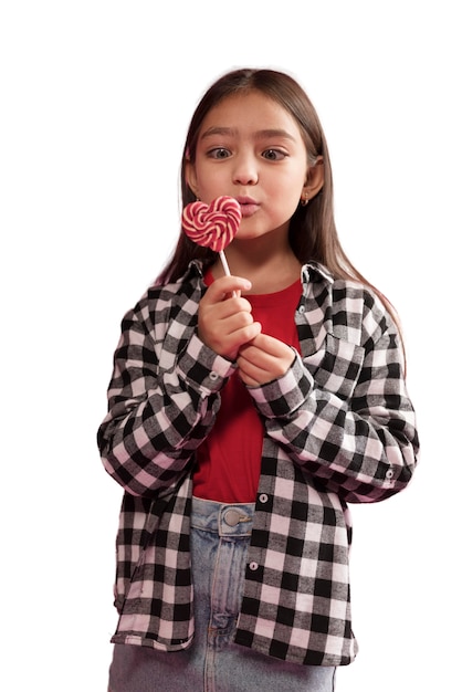 Cute girl holing candies happily