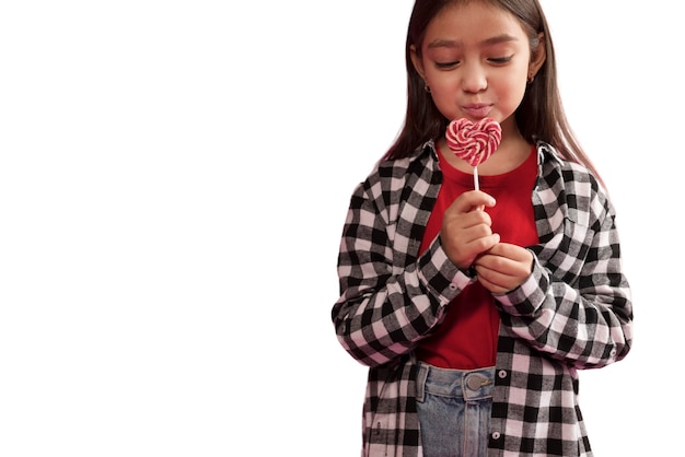 Cute girl holing candies happily