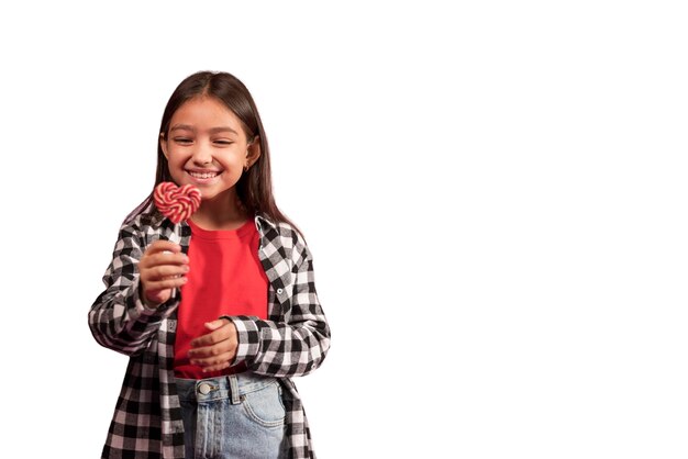 cute girl holing candies happily