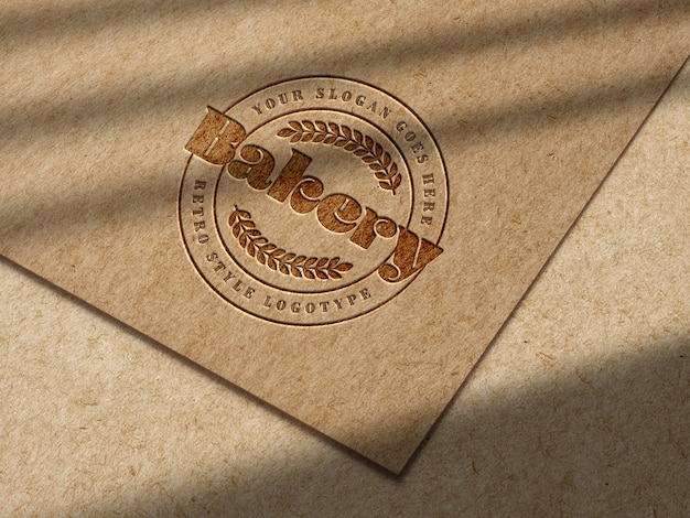 Free PSD debossed logo mockup on kraft paper