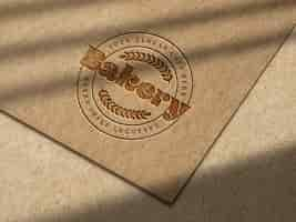 Free PSD debossed logo mockup on kraft paper