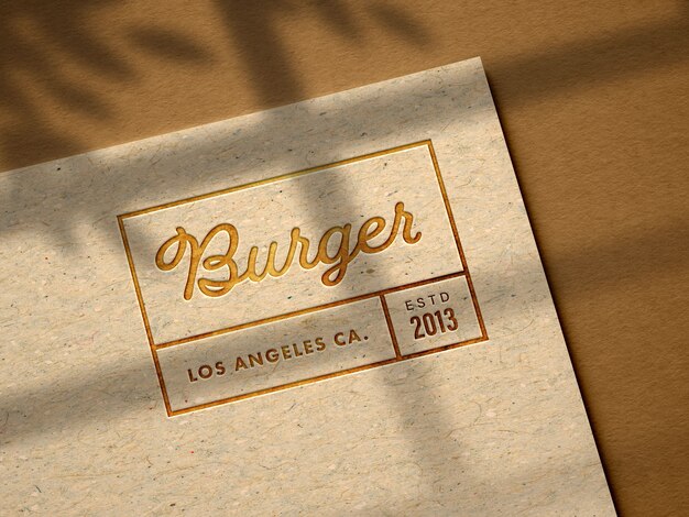 Free PSD debossed logo mockup on kraft paper