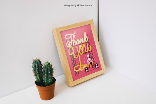 Free PSD decorative photo frame mockup with cactus