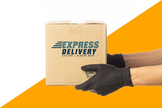 Delivery man hand holding cardboard boxes mockup template for your design. delivery service concept